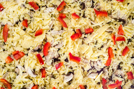 Close-up of homemade pizza with cheese, mushrooms champignons and paprika. Food background, top view.の写真素材