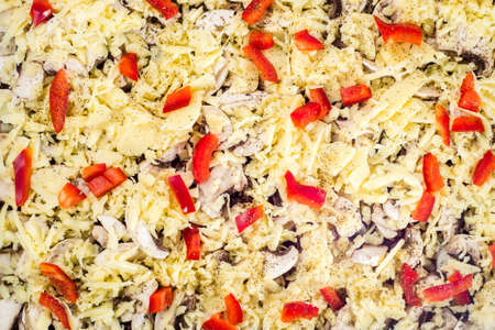 Close-up of homemade pizza with cheese, mushrooms champignons and paprika. Food background, top view.の写真素材