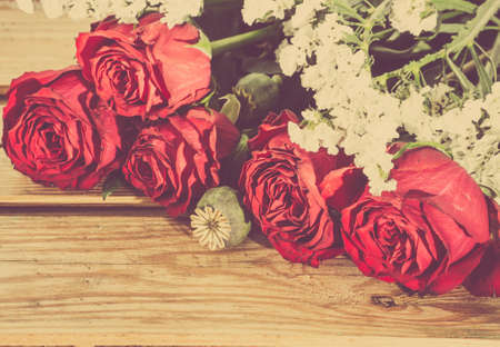 Flowers of roses stylized on vintage on wooden backgrounds.の写真素材