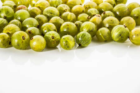 Gooseberries fruits on white background. Ripe summer fruits background.の写真素材