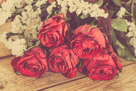 Flowers of roses stylized on vintage on wooden backgrounds.の写真素材