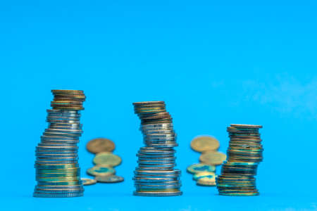 Money stacks. Coins descending in columns. Concept of recession and financial crisis.の写真素材