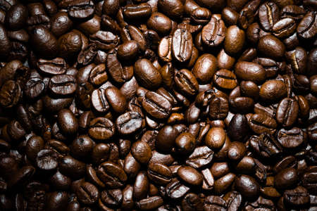 Freshly roasted coffee beans background. Coffee beans texture, top view.の写真素材