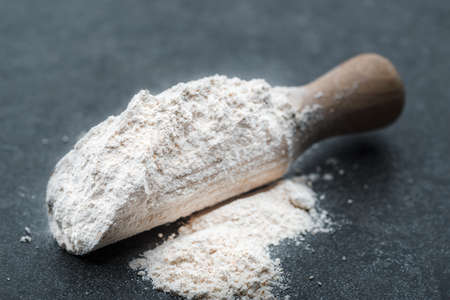 Background with flour on dark tableの写真素材