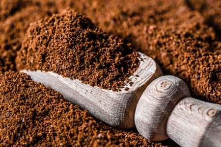 Fresh, ground coffee in wooden scoop.の写真素材