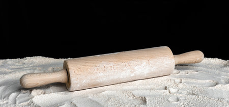 Baking background with rolling pin and flour on table.の写真素材