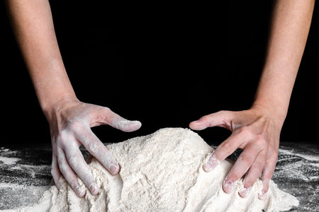 Baker with hands in flour. Baking concept.の写真素材