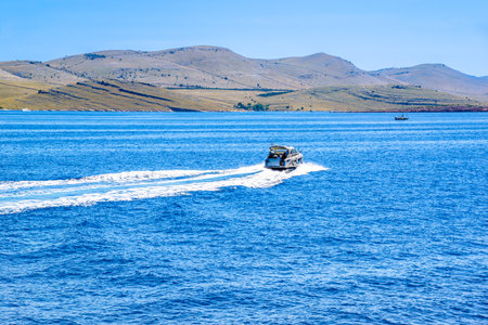 Motor boat near sea coast of croatian islands.の写真素材
