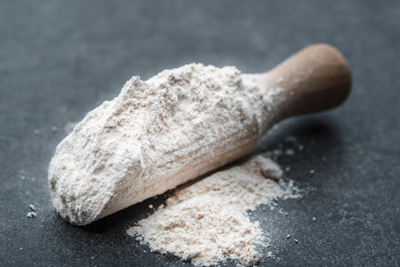 Baking background with flour on dark tableの写真素材