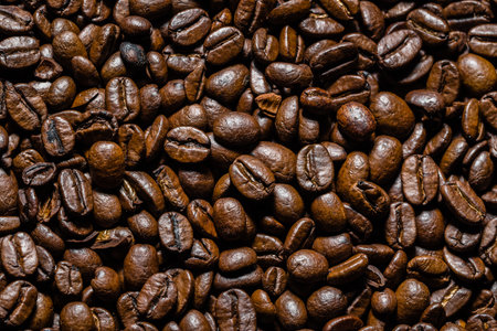 Brown coffee beans background. Coffee beans, top view.の写真素材