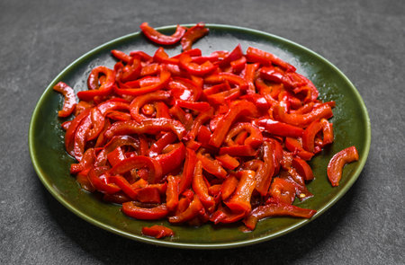 Plate with grilled pepper sliced in strips. Healthy vegan lunch.の写真素材