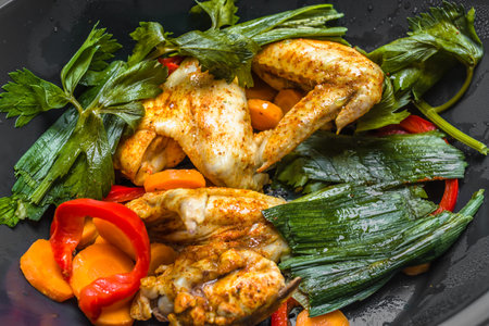Stir fry vegetables with chicken wings. Asian food in a wok.の写真素材