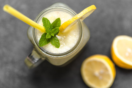 Fresh lemonade in glass jar, top view, close up.の写真素材