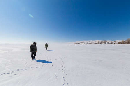 Walking people on frozen lake Ä±n Turkeyの写真素材