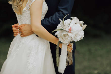 Bride with flowers in your handの写真素材