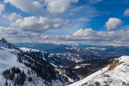 Snowy Mountains and cloudy skies