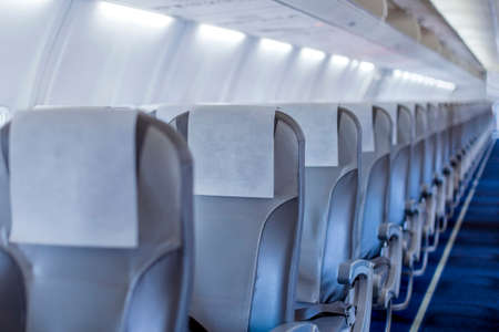 perspective view of empty aircraft seats and lights