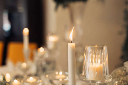 yellow light white candles and candlesの写真素材