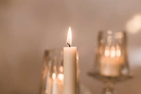 yellow light white candles and candlesの写真素材