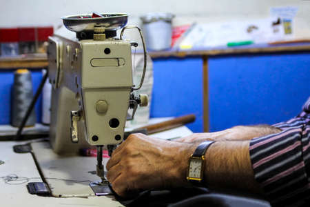 old sewing machine and tailor