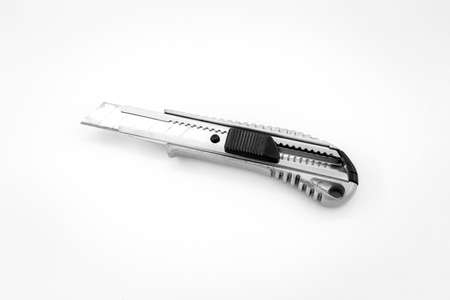 on the White, utility  knife used in cutting