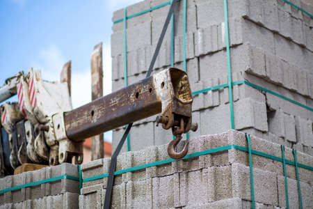 Crane tip standing next to briquettes in Turkey