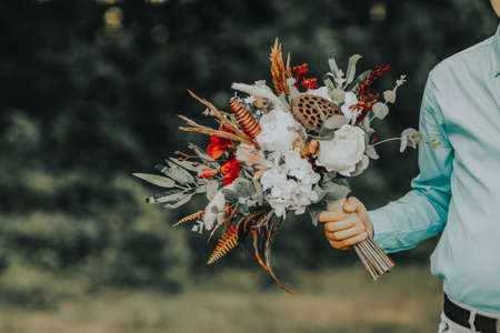 The bride and the flowers in her handの写真素材