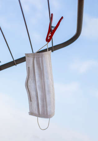 Cleaning by hanging the health maskの写真素材