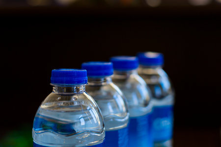 4pcs water bottles with blue lidの写真素材