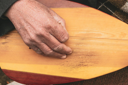 Hand of an old peasant and playing an instrument in Turkey