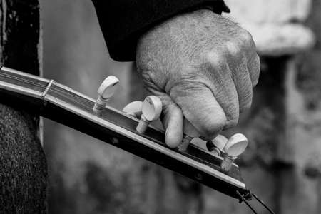 man whose skin made a thatch chord with his dry handの写真素材