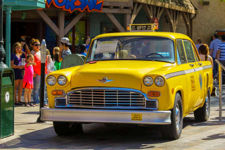 An vintage yellow taxi showcased at Universal Film Studios in Los Angeles.のeditorial素材