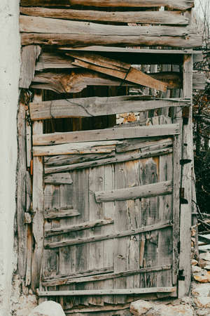 A very old wooden door. wood. An old wooden door texture, rusty nails on it in Turkeyの写真素材
