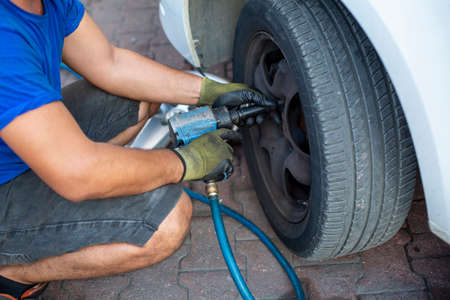 Tire change of a car. tire ripped carの写真素材