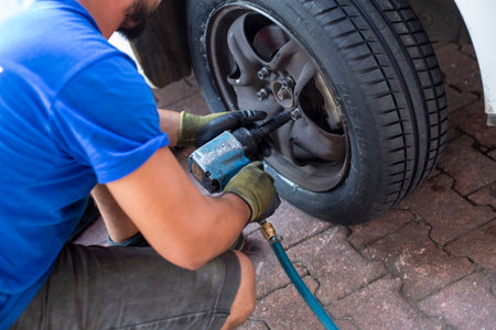 Tire change of a car. tire ripped carの写真素材