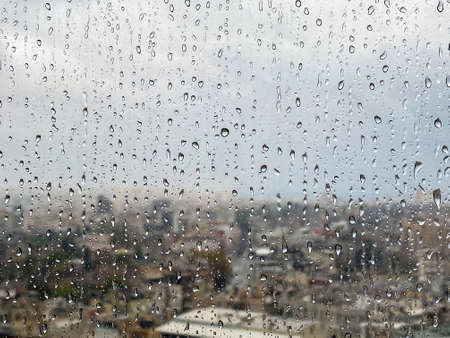 Drop accumulated on the glass after rainの写真素材