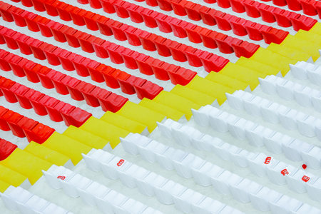Grandstand with red and white seats. rhythm. row seatsの写真素材