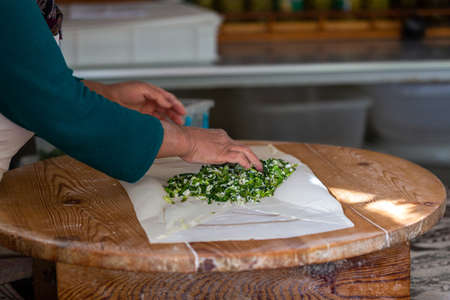 A woman making pancakes in Antalya, Turkey
