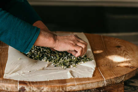 A woman making pancakes in Antalya, Turkeyの写真素材