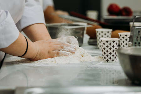 A cook kneading dough for pies in Turkey