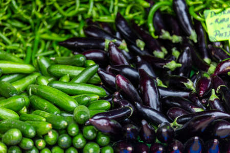 Cucumber, eggplant and pepper sold in the market placeの写真素材