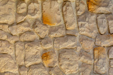 The texture of the stone wall. Background texture of the stone wall of the old building. Stone wall as background or textureの写真素材