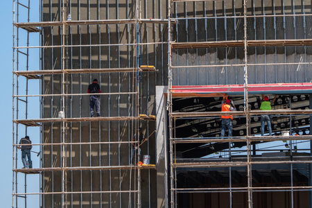 Workers on scaffolding at a construction site in Turkey