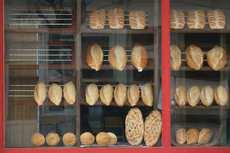 Various breads and pitas in the window of a bakery in Turkey. Retro bakery window.
