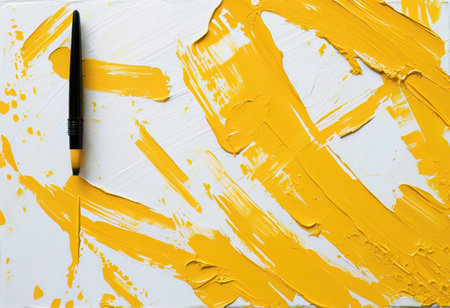 Yellow brush stroke isolated on a white backgroundの素材