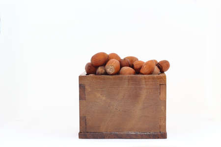 Wooden box with hazelnutsの写真素材