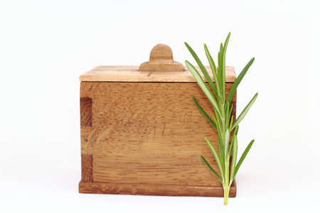 Wooden spice rack with rosemary.の写真素材