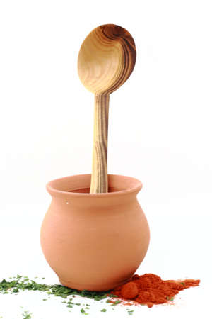 Wooden spoon in clay potの写真素材