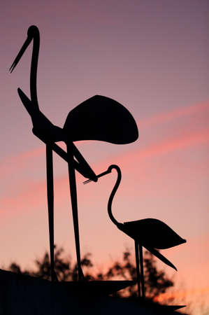 Stork sculpture on purple sky. Sunsetの写真素材