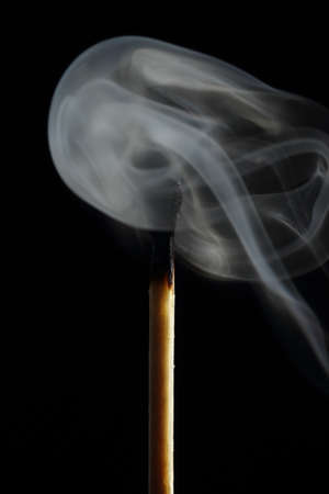 Forms of smoke with a matchの写真素材